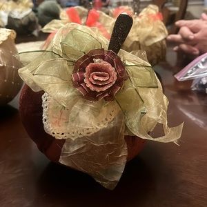 Handmade fabric pumpkin with a silver spoon